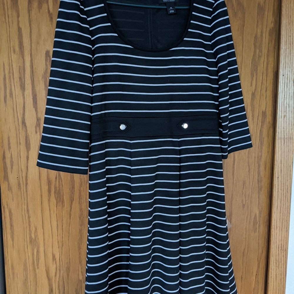 Perfect work dress.  Black and white striped and falls at the knee